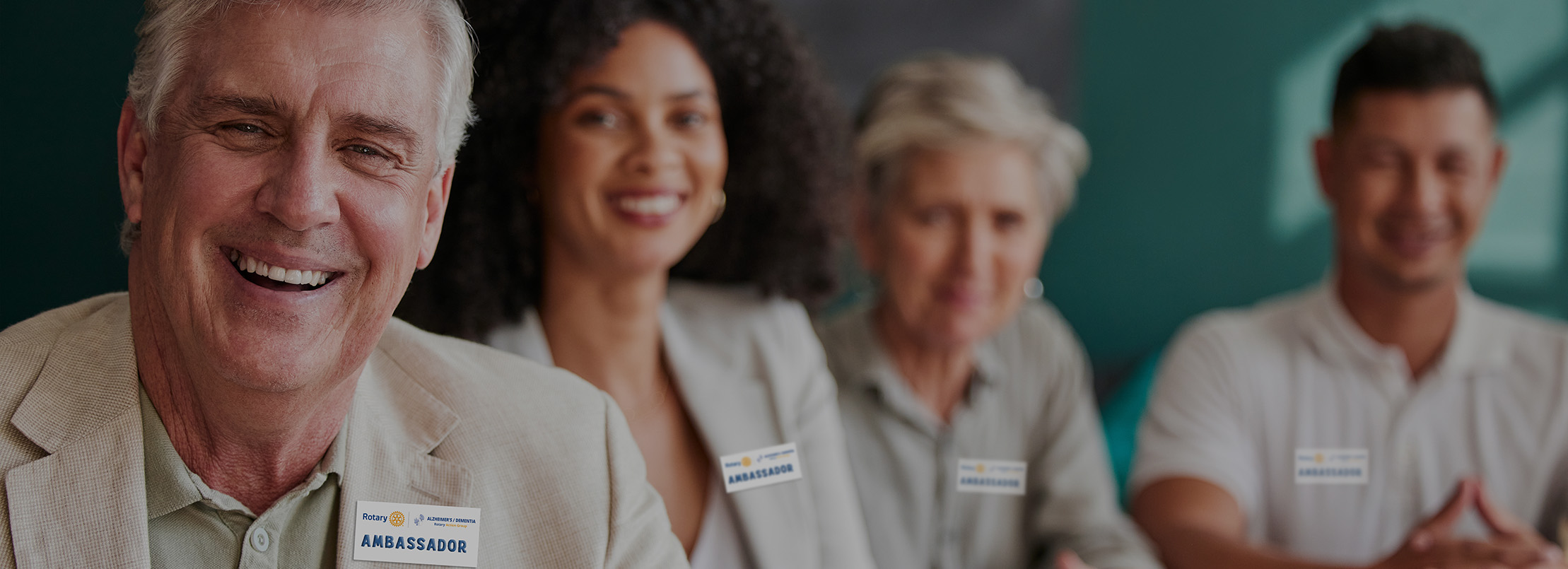 A group of smiling people wearing ADRAG Ambassador badges